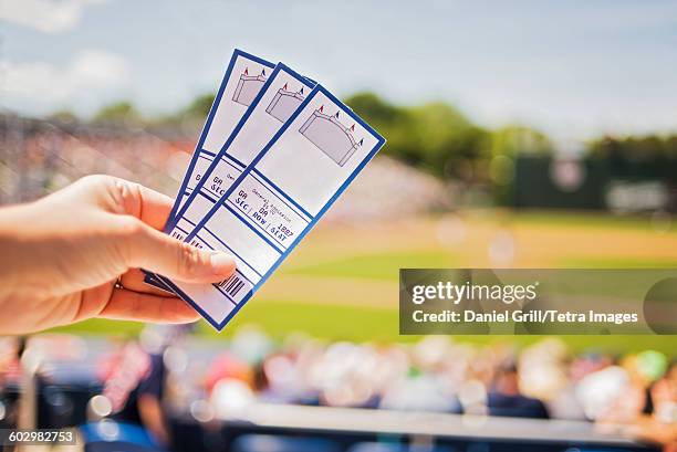 usa, maine, portland, close-up of hand holding tickets at stadium - biljett bildbanksfoton och bilder