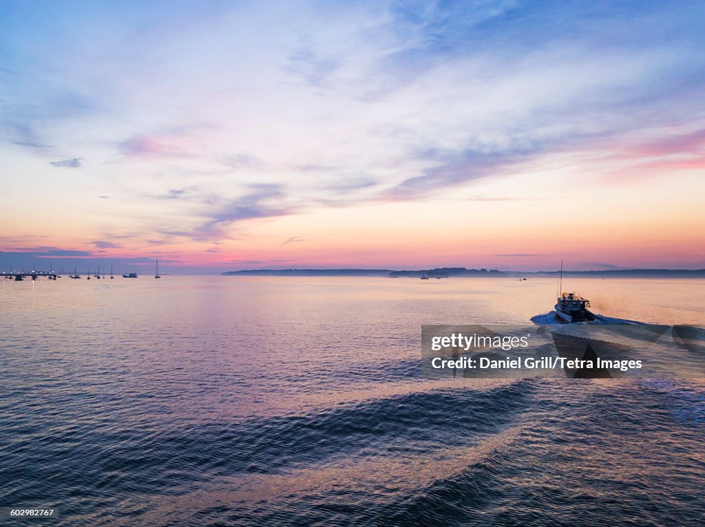 USA, Maine, Portland, Fishing boat heading towards harbor