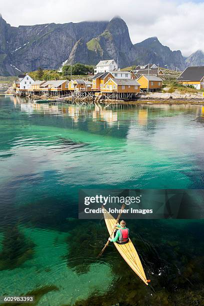 woman kayaking - lofoten island stock pictures, royalty-free photos & images