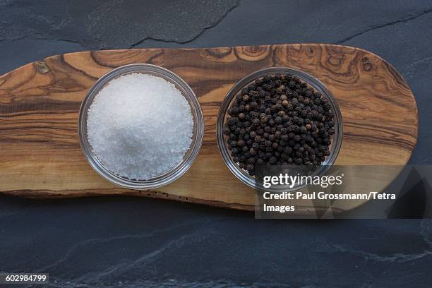 salt and pepper on wood - peppar bildbanksfoton och bilder