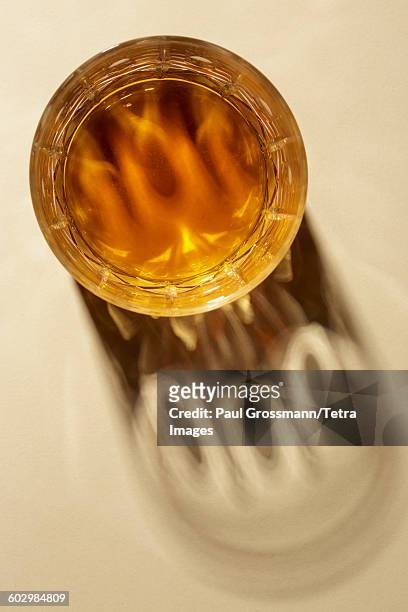 studio shot of glass with alcohol - whiskey stock pictures, royalty-free photos & images