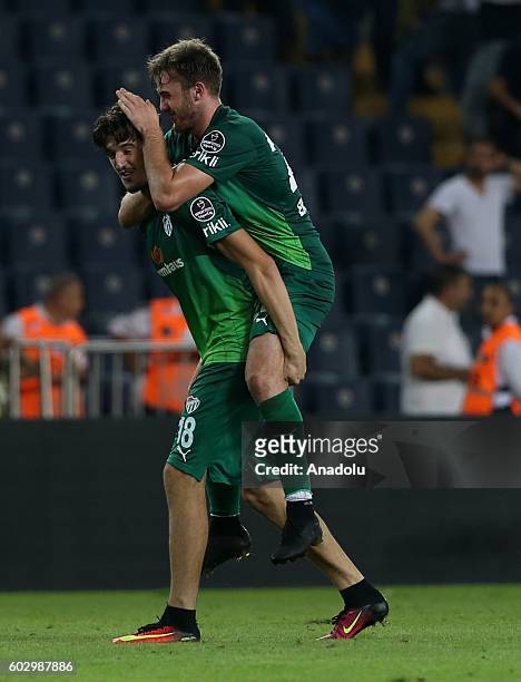 Players of Bursaspor celebrate after winning the Turkish Spor Toto Super Lig football match between Fenerbahce and Bursaspor at Ulker Stadium in...