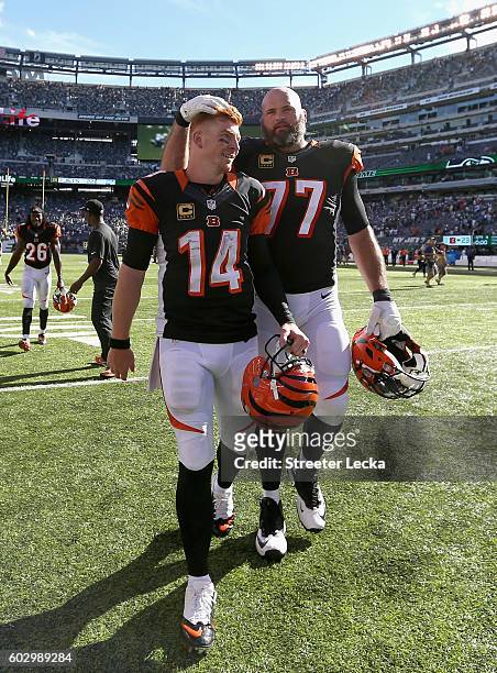 Teammates Andy Dalton and Andrew Whitworth of the Cincinnati Bengals celebrate after a 23-22 victory over the New York Jets during their game at...
