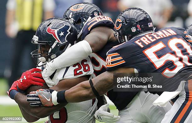 Lamar Miller of the Houston Texans is tackled by Jerrell Freeman of the Chicago Bears in the second half at NRG Stadium on September 11, 2016 in...