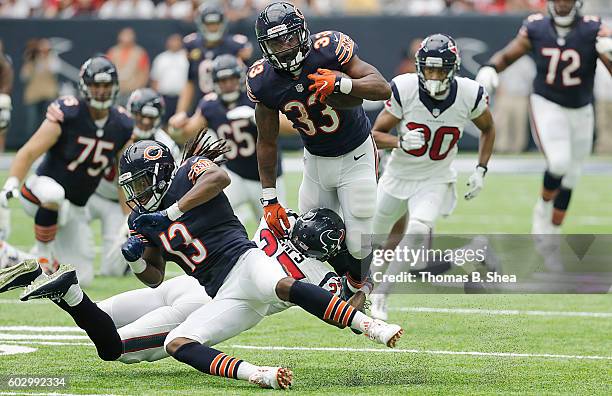 Jeremy Langford of the Chicago Bears is tackled by Quintin Demps of the Houston Texans in the second half at NRG Stadium on September 11, 2016 in...