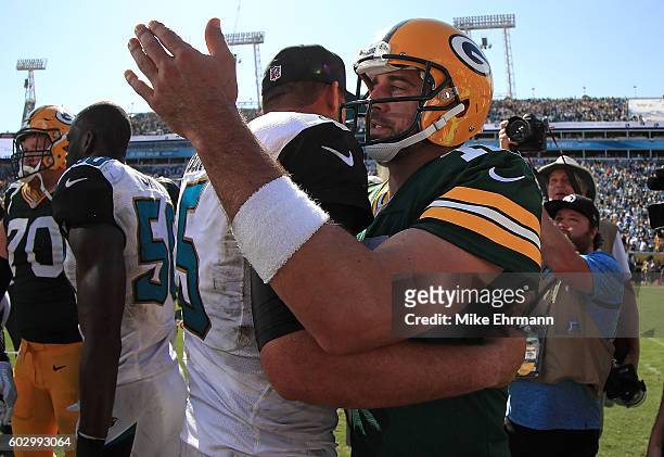 Aaron Rodgers of the Green Bay Packers and Blake Bortles of the Jacksonville Jaguars shake hands during a game at EverBank Field on September 11,...