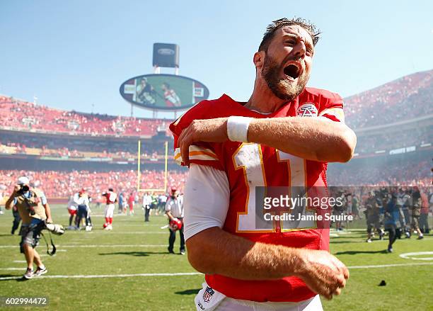 Quarterback Alex Smith of the Kansas City Chiefs celebrates after scoring a touchdown as the Chiefs defeat the San Diego Chargers 33-27 to win the...