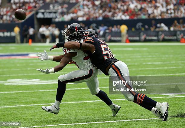 Tyler Ervin of the Houston Texans attempts to make a catch as Jerrell Freeman of the Chicago Bears defends at NRG Stadium on September 11, 2016 in...