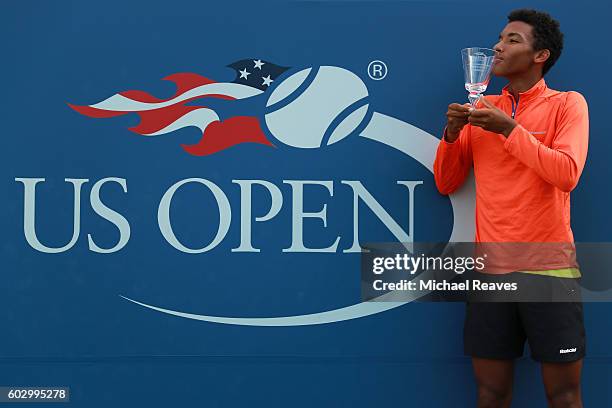 Felix Auger-Aliassime of Canada celebrates after defeating Miomir Kecmanovic of Serbia in their Junior Boys' Singles Final Match on Day Fourteen of...