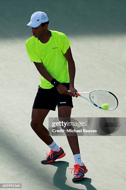 Felix Auger-Aliassime of Canada in action against Miomir Kecmanovic of Serbia in their Junior Boys' Singles Final Match on Day Fourteen of the 2016...