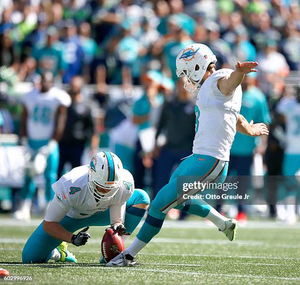 Kicker Andrew Franks of the Miami Dolphins hits a 41-yard field goal to tie the game 3-3 in the first half against the Seattle Seahawks at...