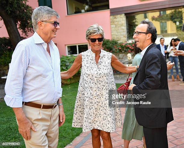 Evelina Christillin, Gabriele Galateri Di Genola and Roberto Benigni attend the Festival Della Comunicazione on September 11, 2016 in Camogli, Italy.