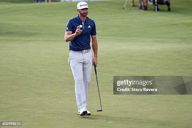 Dustin Johnson waves to the crowd after winning the BMW Championship at Crooked Stick Golf Club on September 11, 2016 in Carmel, Indiana.