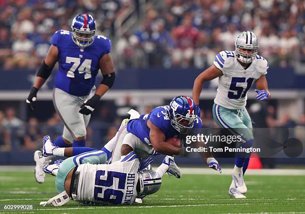 Shane Vereen of the New York Giants is tackled by Anthony Hitchens of the Dallas Cowboys during the first half at AT&T Stadium on September 11, 2016...