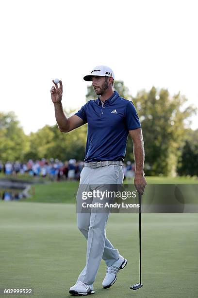 Dustin Johnson waves to the crowd after winning the BMW Championship at Crooked Stick Golf Club on September 11, 2016 in Carmel, Indiana.