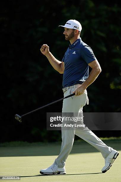 Dustin Johnson reacts to a putt for eagle on the 15th green during the final round of the BMW Championship at Crooked Stick Golf Club on September...