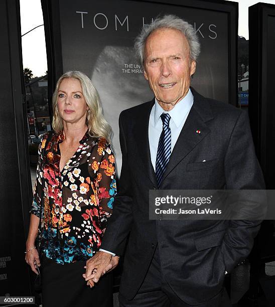 Director Clint Eastwood and Christina Sandera attend a screening of "Sully" at Directors Guild Of America on September 8, 2016 in Los Angeles,...