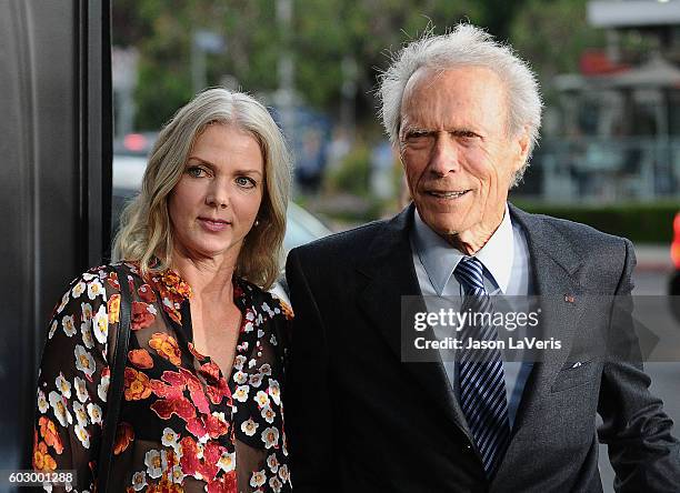 Director Clint Eastwood and Christina Sandera attend a screening of "Sully" at Directors Guild Of America on September 8, 2016 in Los Angeles,...