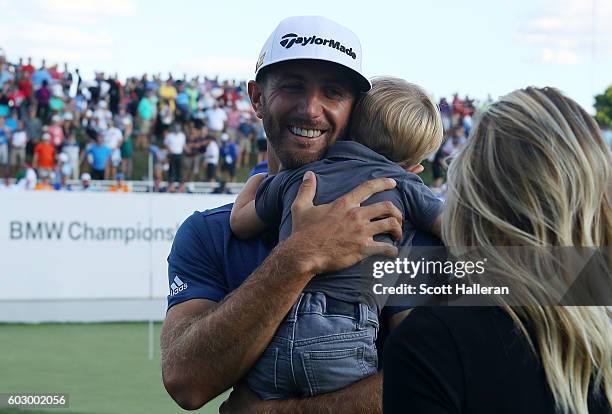 Dustin Johnson holds his son Tatum Johnson after the final round of the BMW Championship at Crooked Stick Golf Club on September 11, 2016 in Carmel,...