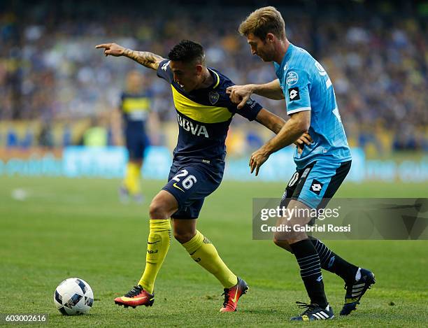 Adrian Centurion of Boca Juniors fights for the ball with Mario Bolatti of Belgrano during a match between Boca Juniors and Belgrano as part of...