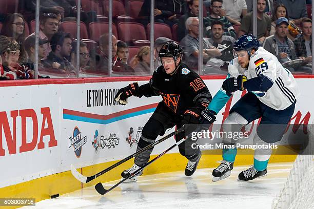 Jack Eichel of Team North America and Leon Draisaitl of Team Europe skate for the puck during the pre-tournament World Cup of Hockey game at the Bell...