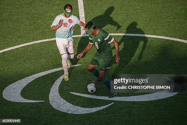 Turkey's Celal Coban vies with Brazilian Nonato during their football 5-a-side match Brazil vs Turquia, during the Rio 2016 Paralympic Games in Rio...