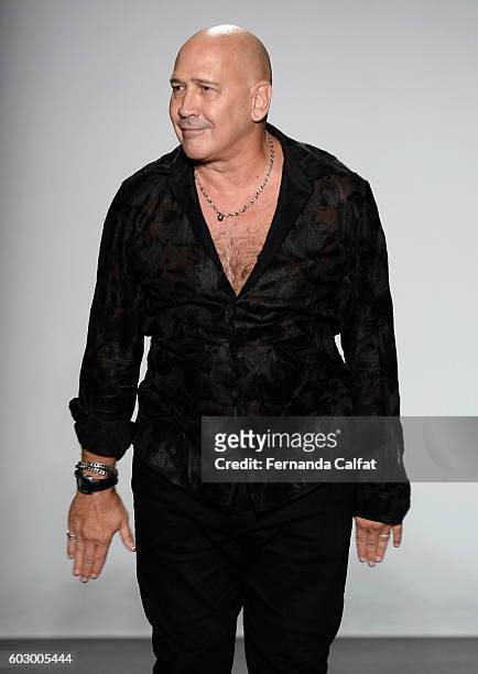 Designer Carmen Marc Valvo poses on the runway at the Carmen Marc Valvo Spring/Summer 2017 Fashion Show during New York Fashion Week at Pier 59...