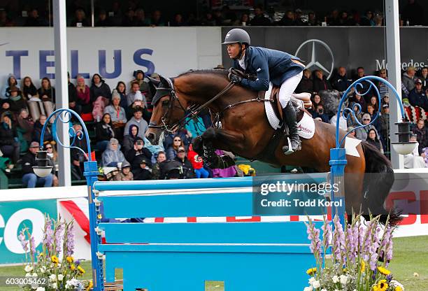 Kent Farrington of the United States rides his horse Voyeur during the Spruce Meadows CP International Grand Prix on September 11, 2016 in Calgary,...