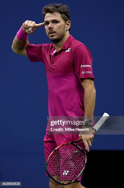 Stan Wawrinka of Switzerland celebrates after winning the third set against Novak Djokovic of Serbia during their Men's Singles Final Match on Day...