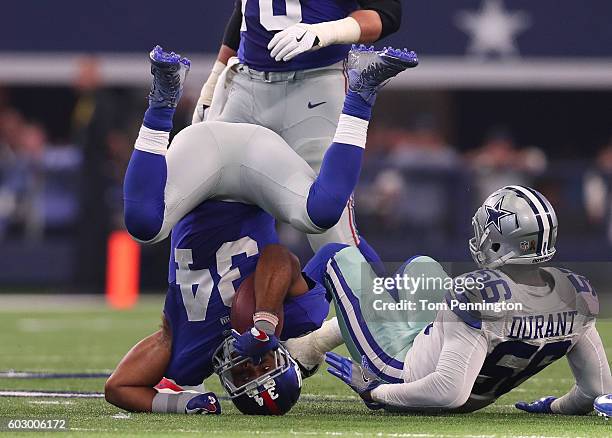 Shane Vereen of the New York Giants is tackled by Justin Durant of the Dallas Cowboys during the fourth quarter at AT&T Stadium on September 11, 2016...