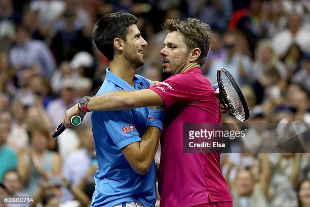 Stan Wawrinka of Switzerland embraces Novak Djokovic of Serbia after defeating him with a score of 6-7, 6-4, 7-5, 6-3 during their Men's Singles...