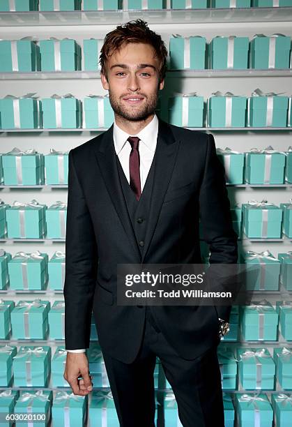 Actor Douglas Booth attends the Vanity Fair and Tiffany & Co. Private dinner toasting Lupita Nyong'o and celebrating Legendary Style at Shangri-La...
