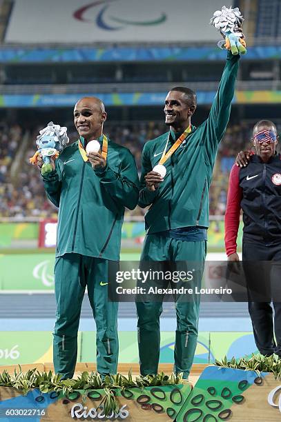 Silver medalist Felipe Gomes of Brazil celebrate on the podium at the medal ceremony for the Menâs 100m â T11 Final during day 4 of the Rio 2016...