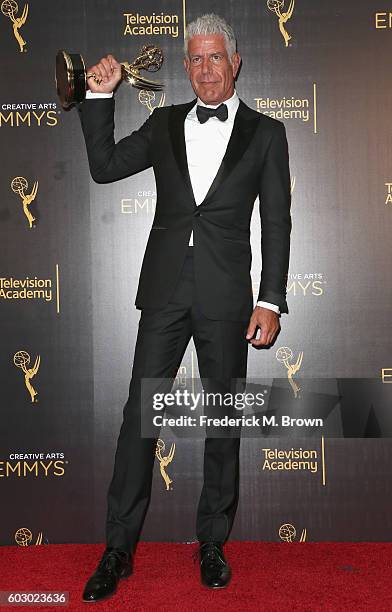 Personality Anthony Bourdain, winner of Outstanding Informational Series Or Special, poses in the press room during the 2016 Creative Arts Emmy...