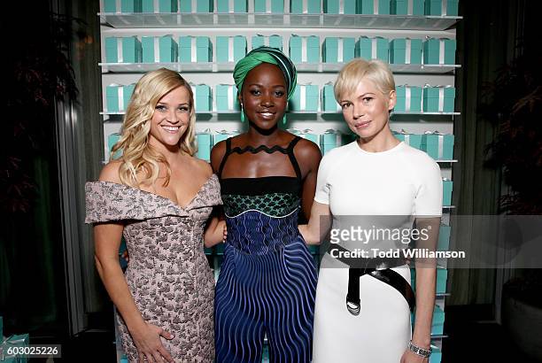 Actresses Reese Witherspoon, Lupita Nyong'o and Michelle Williams attend the Vanity Fair and Tiffany & Co. Private dinner toasting Lupita Nyong'o and...