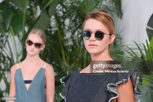 Models pose at the Krewe New Orleans Eyewear presentation during MADE Fashion Week September 2016 at Milk Studios on September 11, 2016 in New York...
