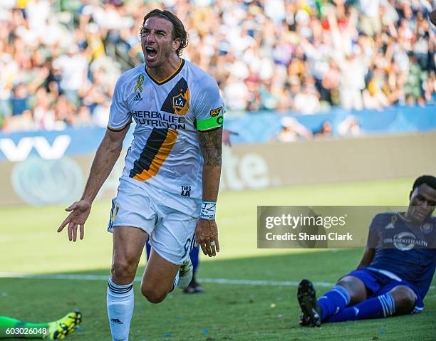 Alan Gordon of Los Angeles Galaxy celebrates his a goal during Los Angeles Galaxy's MLS match against Orlando City SC at the StubHub Center on...