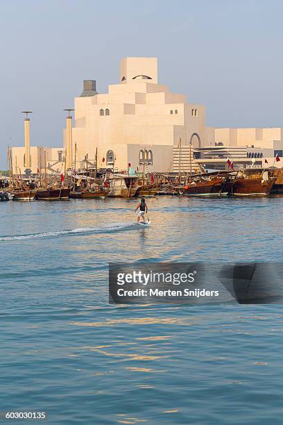 jetsurfing in dhow harbour - doha museum stock pictures, royalty-free photos & images