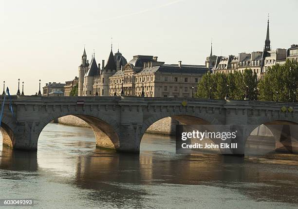 paris, conciergerie with pont neuf bridge - pont neuf stock pictures, royalty-free photos & images