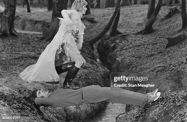 British comic actor Peter Cook with actress Judy Huxtable, filming a scene for the television show 'Where Do I Sit?' at Black Park, Buckinghamshire,...