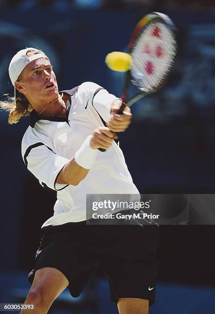 Lleyton Hewitt of Australia makes a back hand return to Tommy Haas during their Men's Singles second round match of the Australian Open on 21 January...