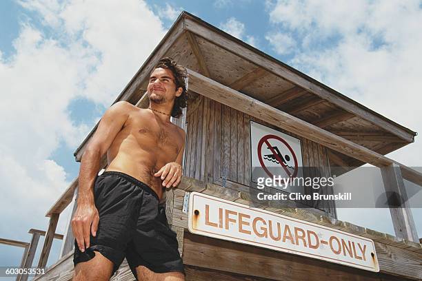 Roger Federer of Switzerland poses next to a Lifeguard post on the beach at the ATP Ericsson Open Tennis Championship on 27 March 2000 in Key...