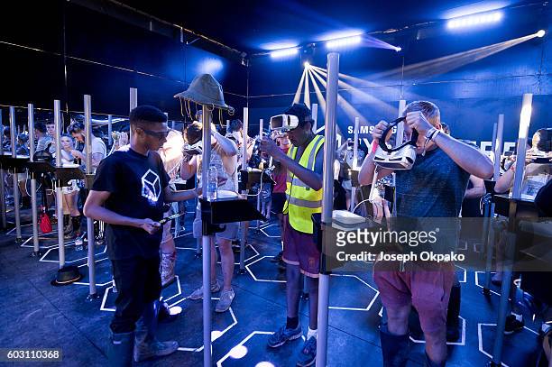Festival goers wear Gear VR headsets to watch Biffy Clyros immersive music video of the new track Flammable in the Samsung Hypercube on Day 4 of...