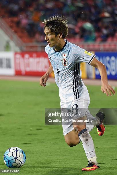Genki Haraguchi of Japan dribbles during the 2018 FIFA World Cup Qualifier between Thailand and Japan at the Rajamangala National Stadium on...