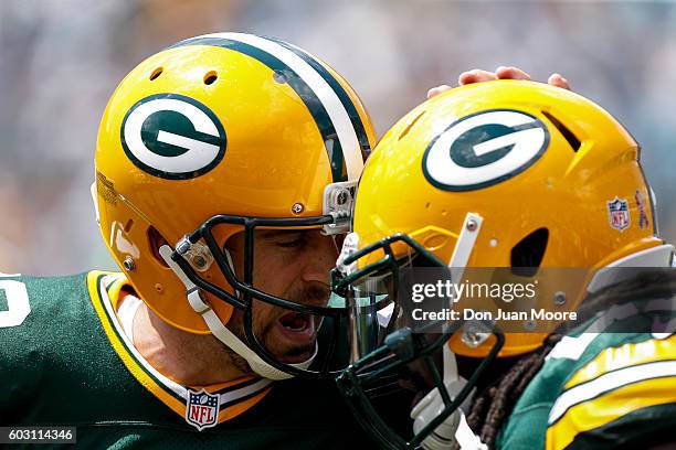 Quarterback Aaron Rogers and running back Eddie Lacy of the Green Bay Packers celebrates after a touchdown during the game against the Jacksonville...