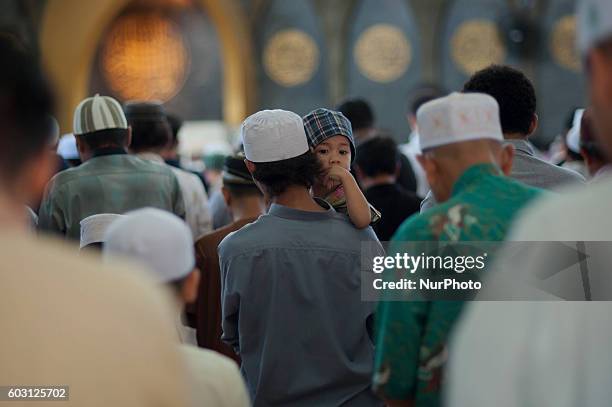 Thai Muslims attend the prayer on the occasion of Eid al-Adha in Islamic Center of Thailand Bangkok on September 12, 2016.