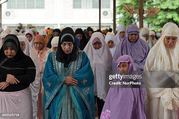 Thai Muslims attend the prayer on the occasion of Eid al-Adha in Islamic Center of Thailand Bangkok on September 12, 2016.