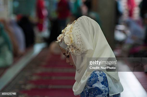 Thai Muslims attend the prayer on the occasion of Eid al-Adha in Islamic Center of Thailand Bangkok on September 12, 2016.