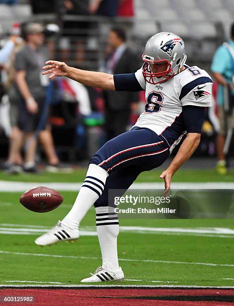 Punter Ryan Allen of the New England Patriots warms up before the team's NFL game against the Arizona Cardinals at University of Phoenix Stadium on...