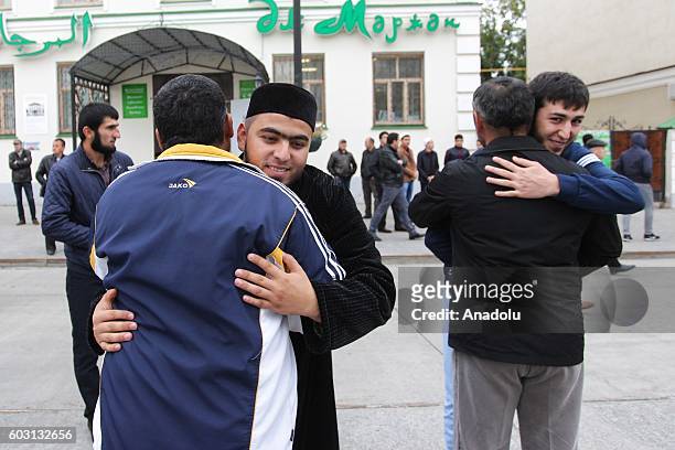 Muslims exchange greetings after performing Eid Al-Adha prayer at Al-Marjani Mosque in Kazan, Russia on September 12, 2016.